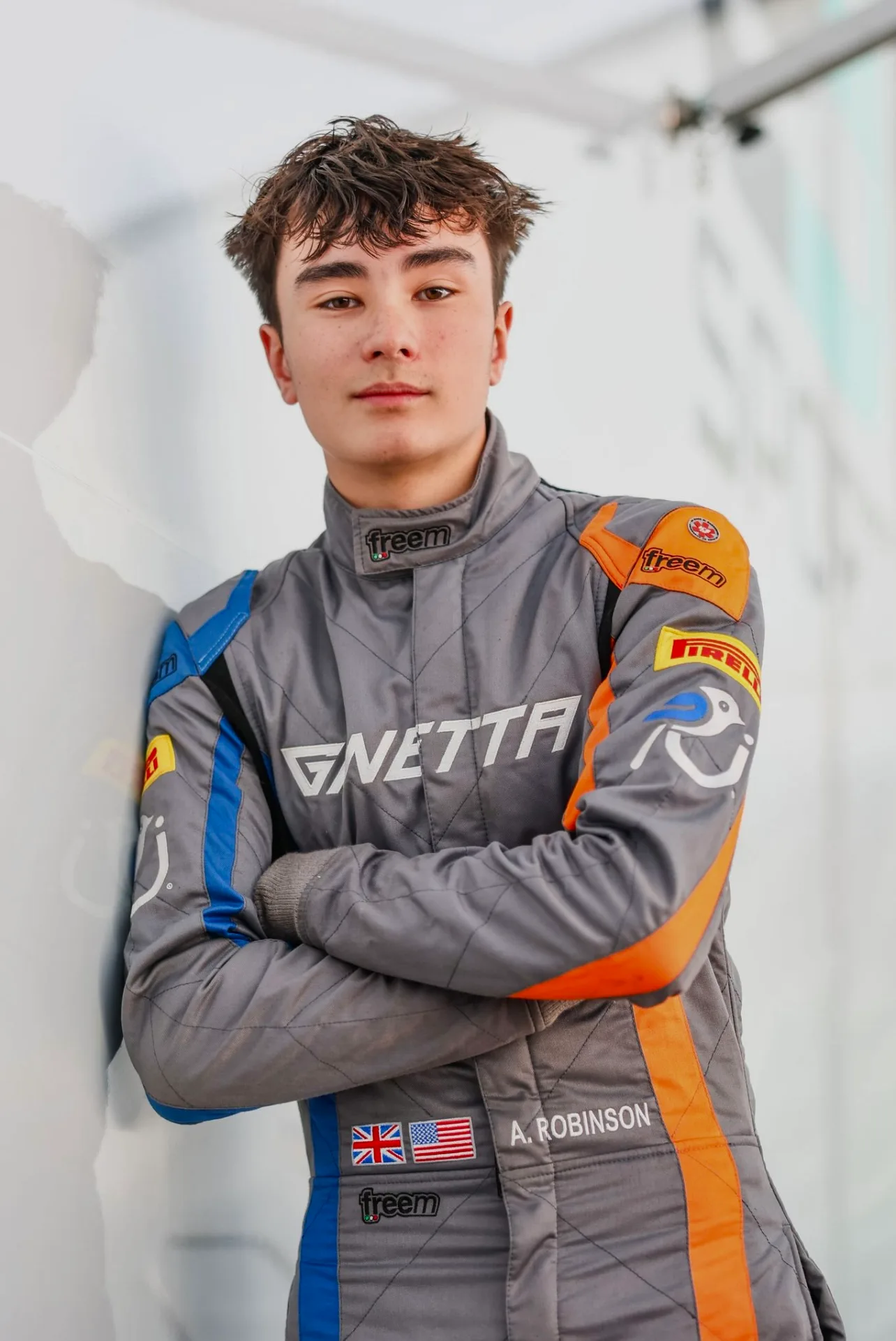 Andrew Robinson in race gear on the grid